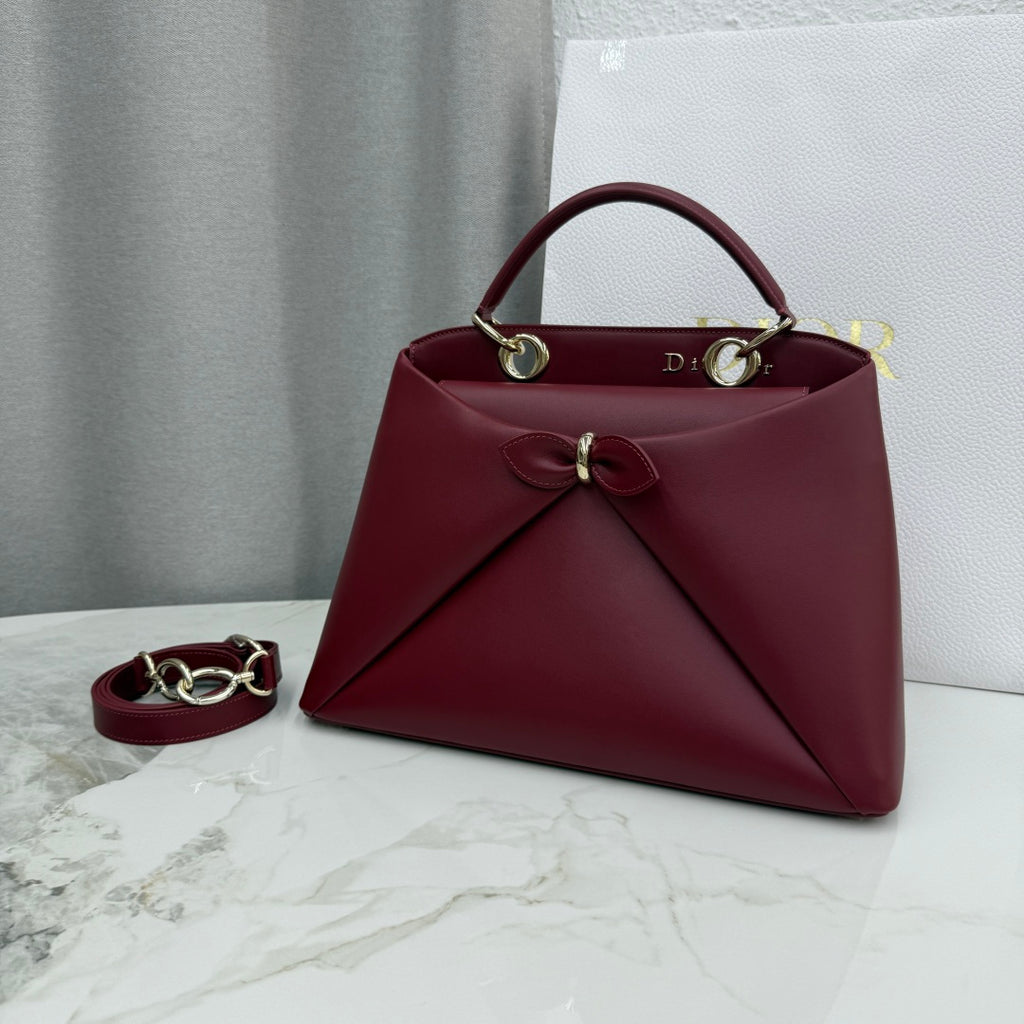 Dior 2026 Spring/Summer Bow Handbag — Burgundy with Gold Hardware