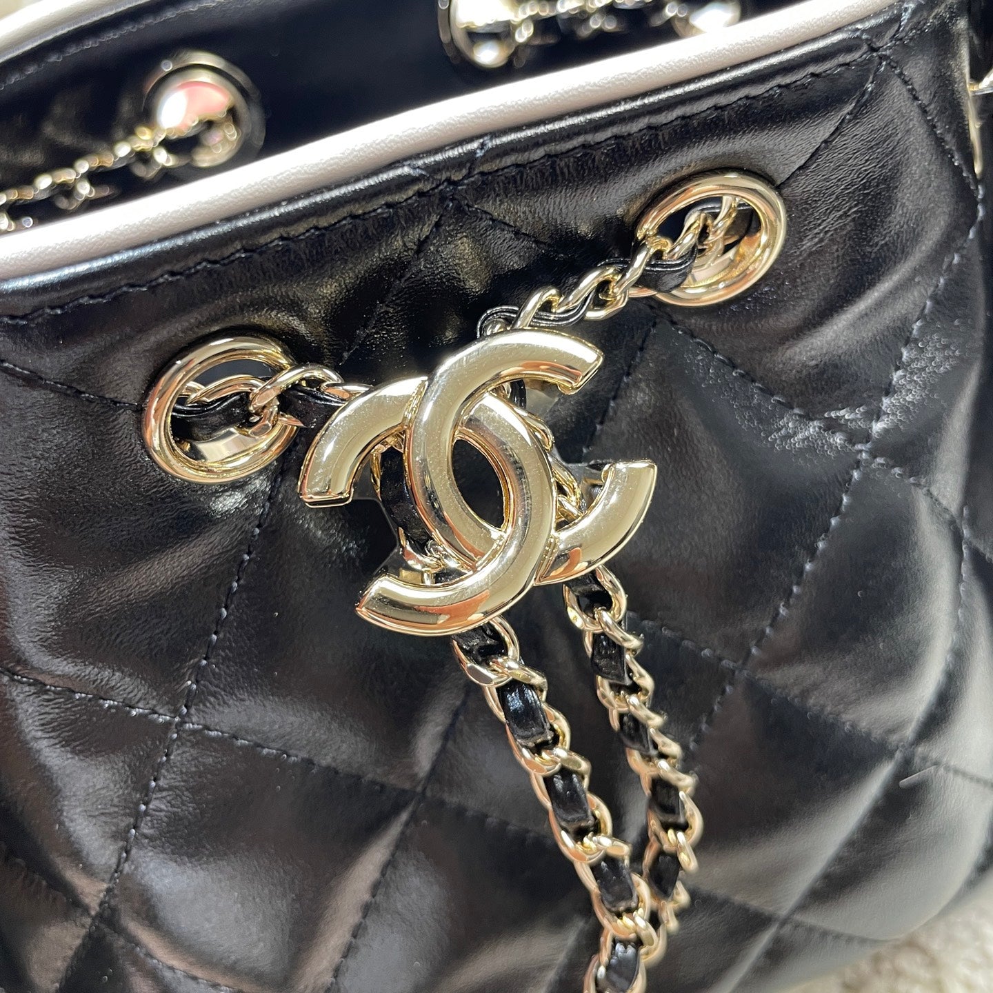 Chanel 25C Cruise Quilted Lambskin Drawstring Mini Bucket Bag Black & Silver