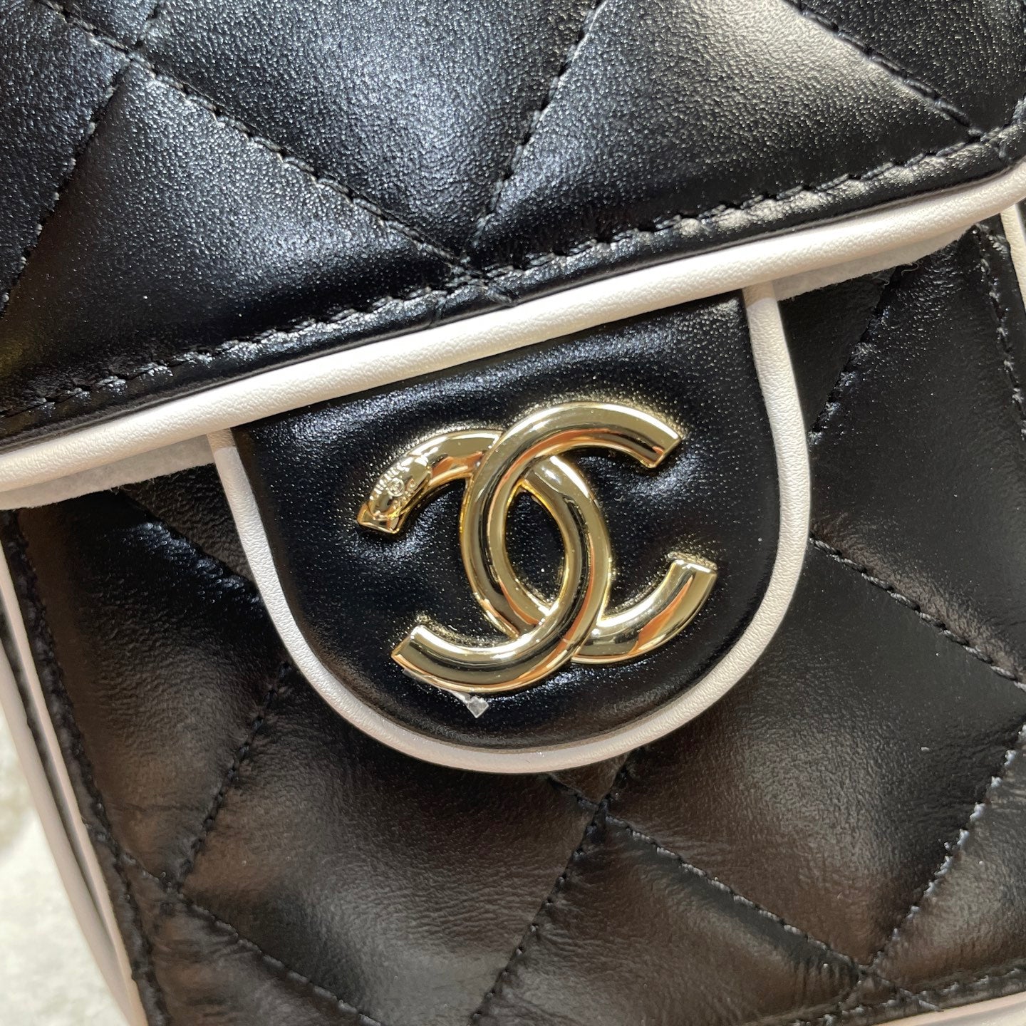 Chanel 25C Cruise Quilted Lambskin Drawstring Mini Bucket Bag Black & Silver