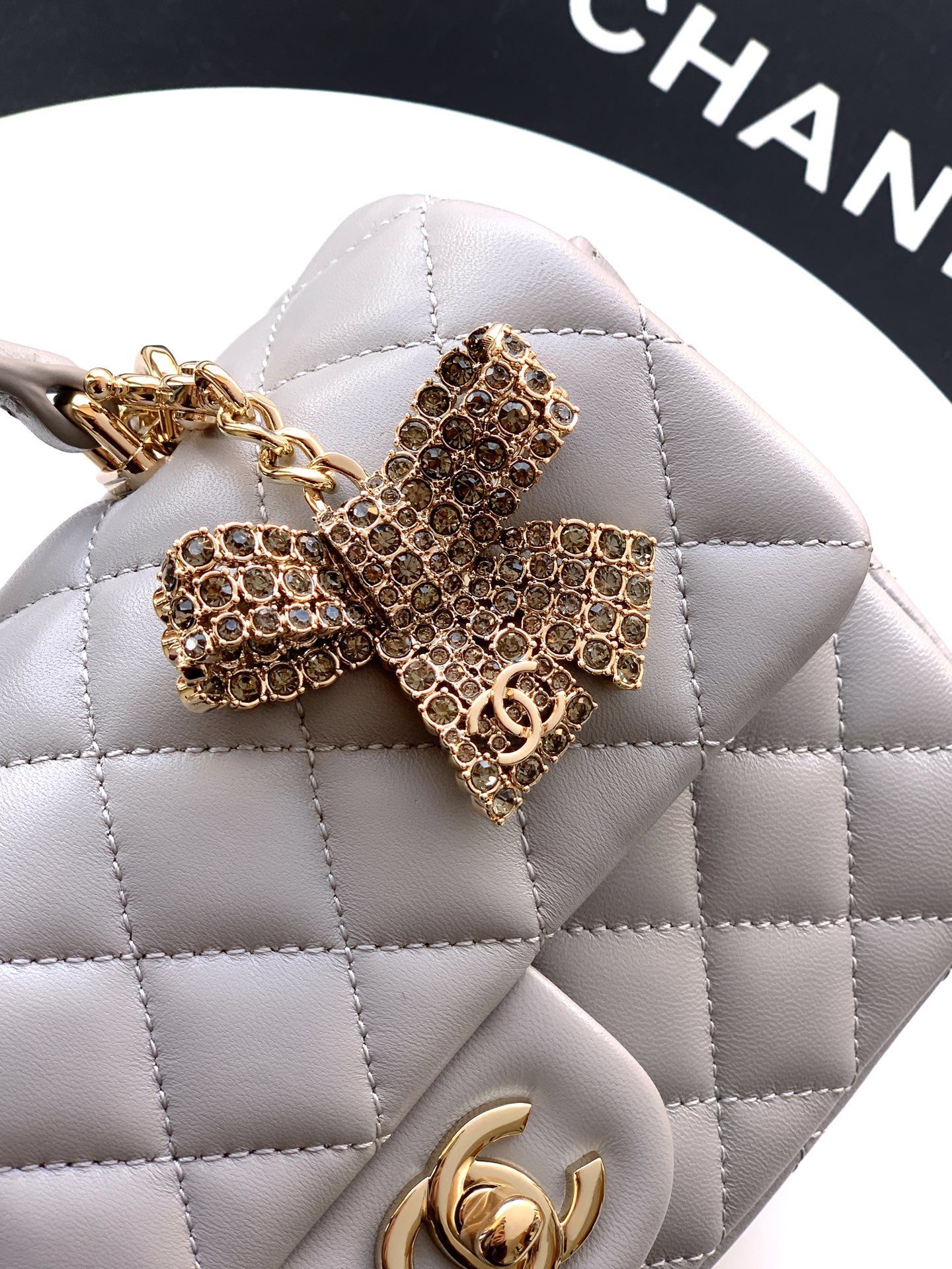 Chanel 25K Coco Handle Mini CF — Light Grey Lambskin with Crystal Bow & Gold Hardware