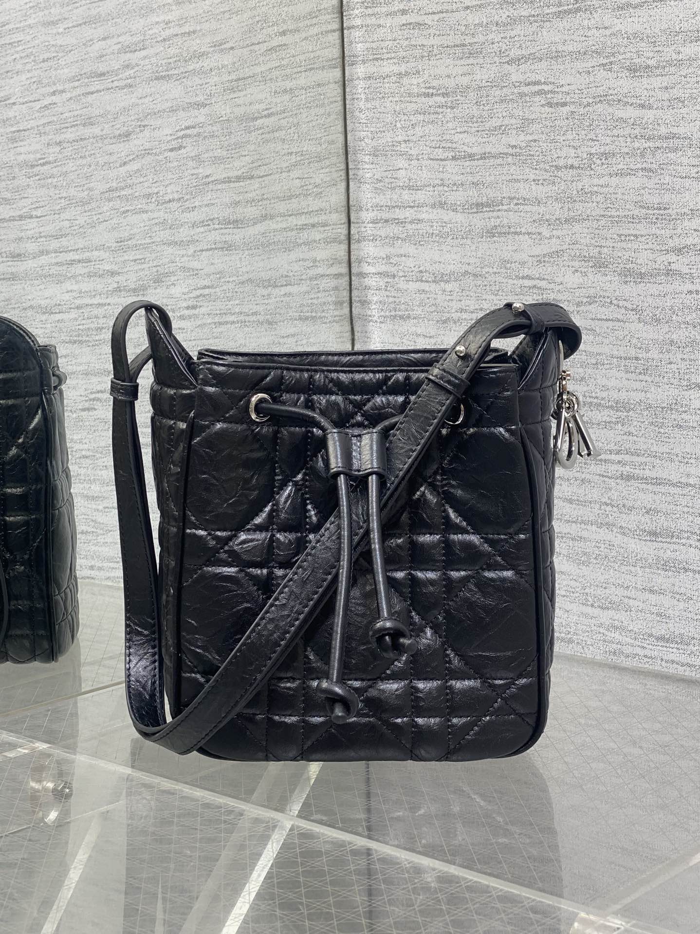 Dior Caro Motion Small Drawstring Bucket Bag Black Aged Leather Quilted Crossbody 1025