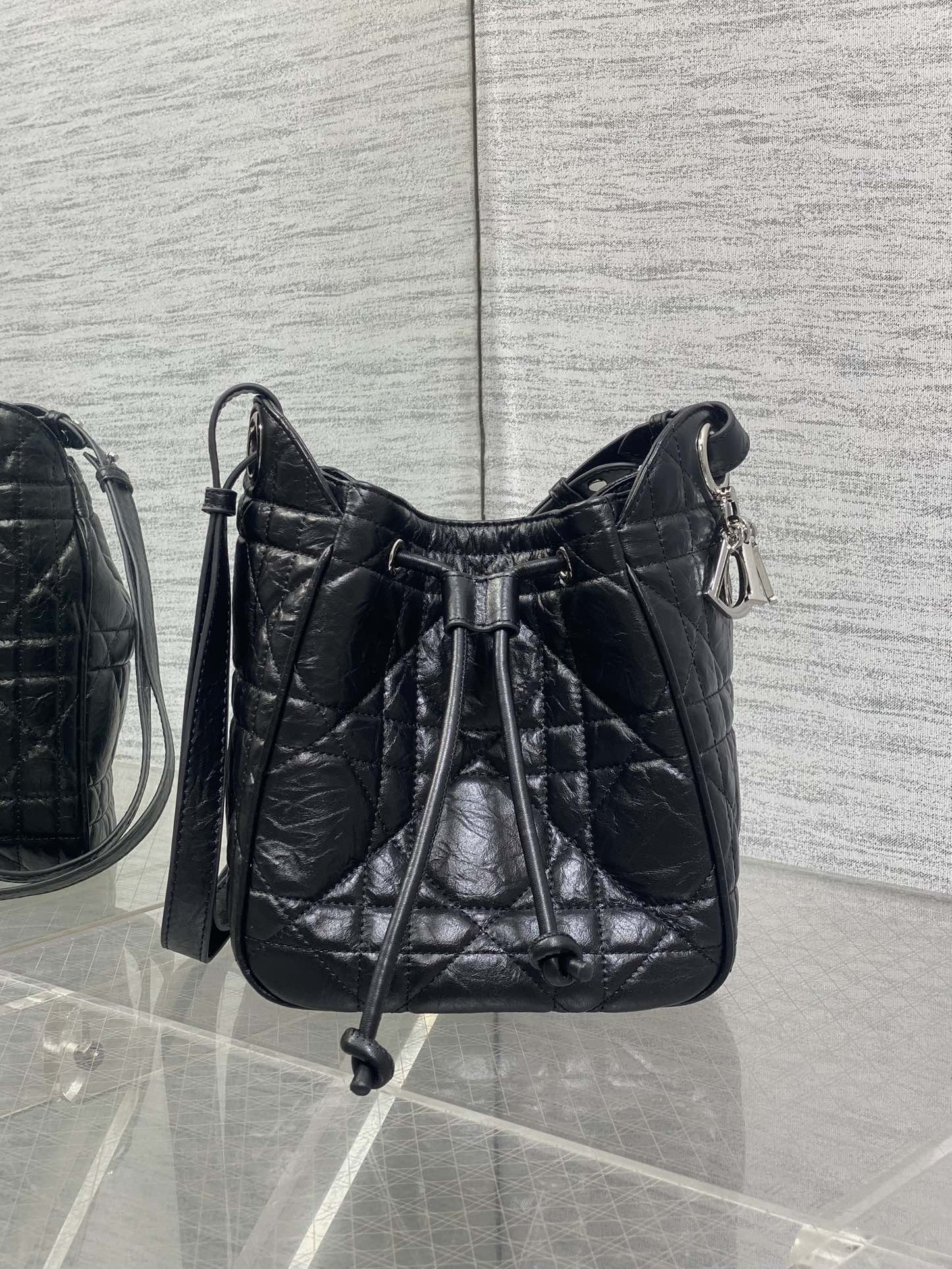 Dior Caro Motion Small Drawstring Bucket Bag Black Aged Leather Quilted Crossbody 1025
