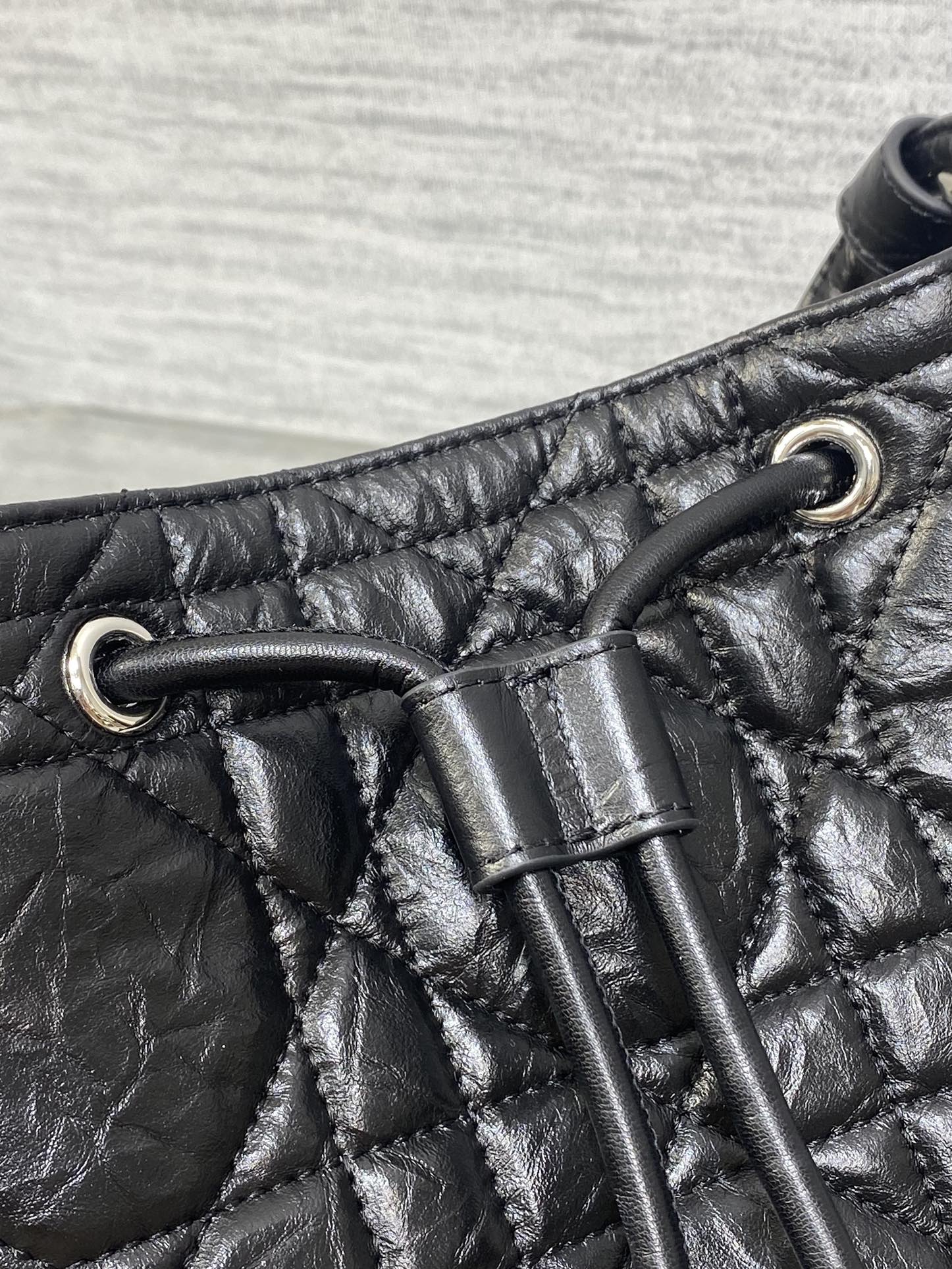Dior Caro Motion Small Drawstring Bucket Bag Black Aged Leather Quilted Crossbody 1025
