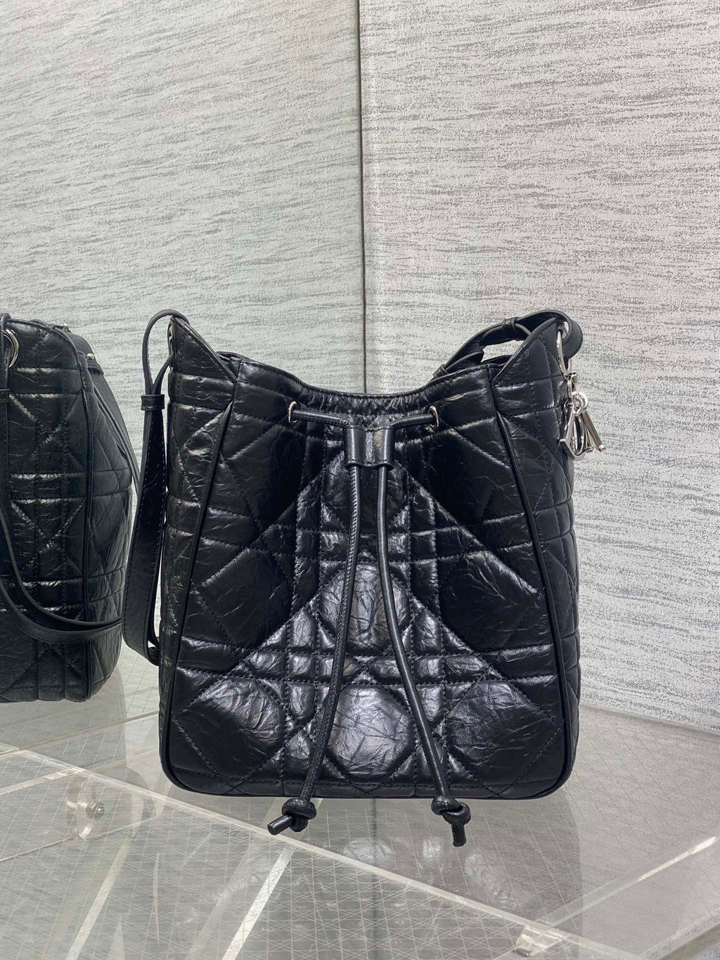 Dior Caro Motion Medium Drawstring Bucket Bag Black Aged Leather Quilted Crossbody 1026
