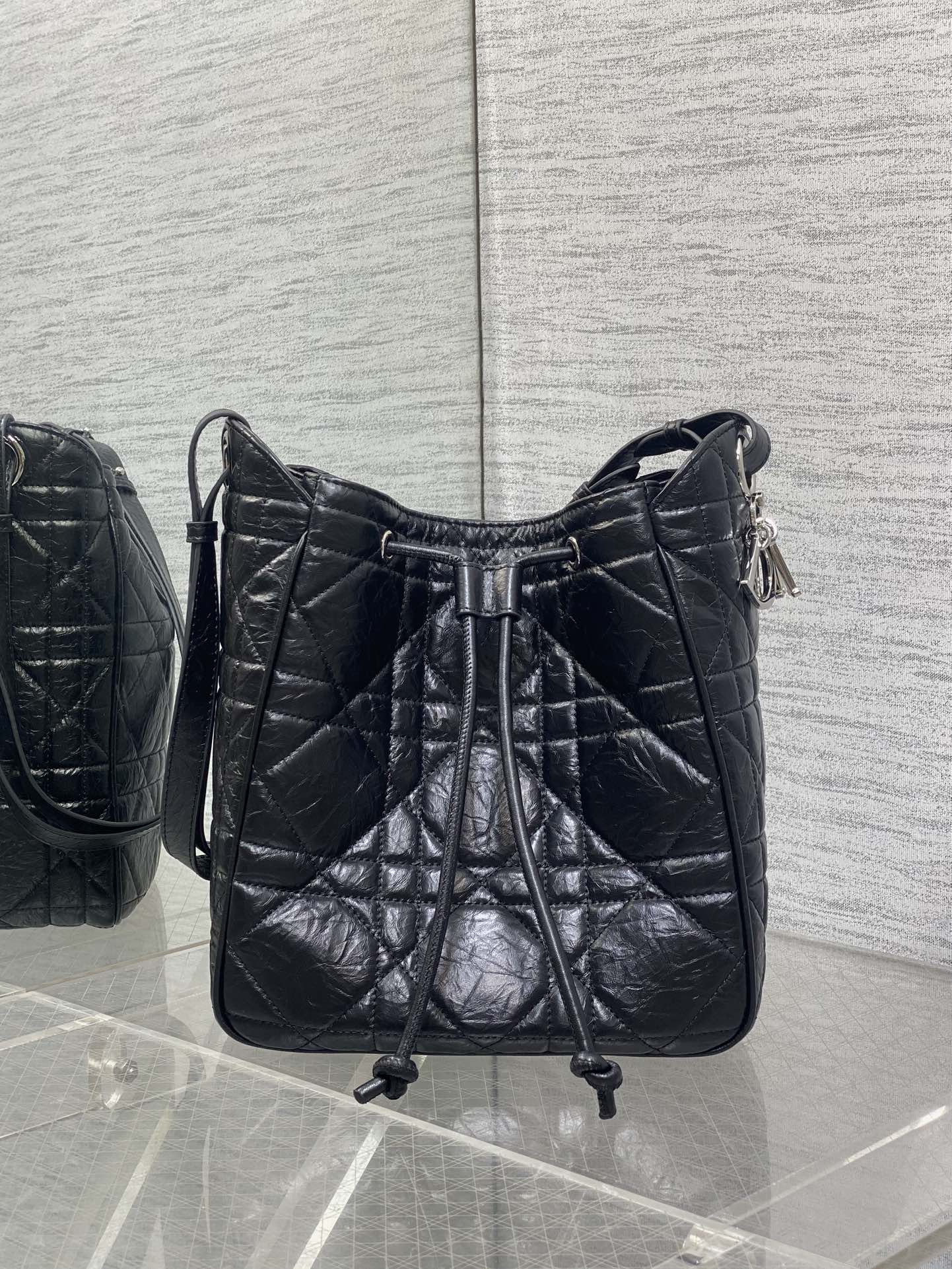 Dior Caro Motion Medium Drawstring Bucket Bag Black Aged Leather Quilted Crossbody 1026