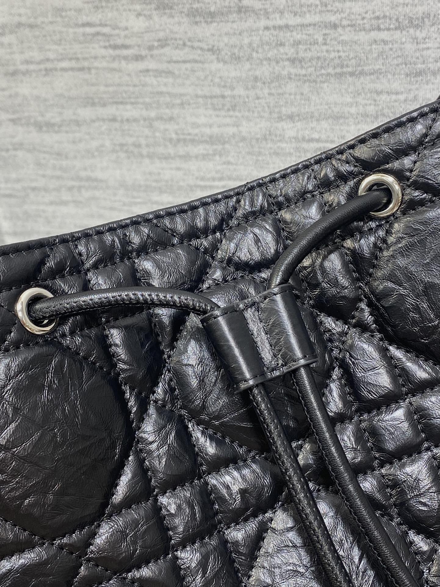 Dior Caro Motion Medium Drawstring Bucket Bag Black Aged Leather Quilted Crossbody 1026