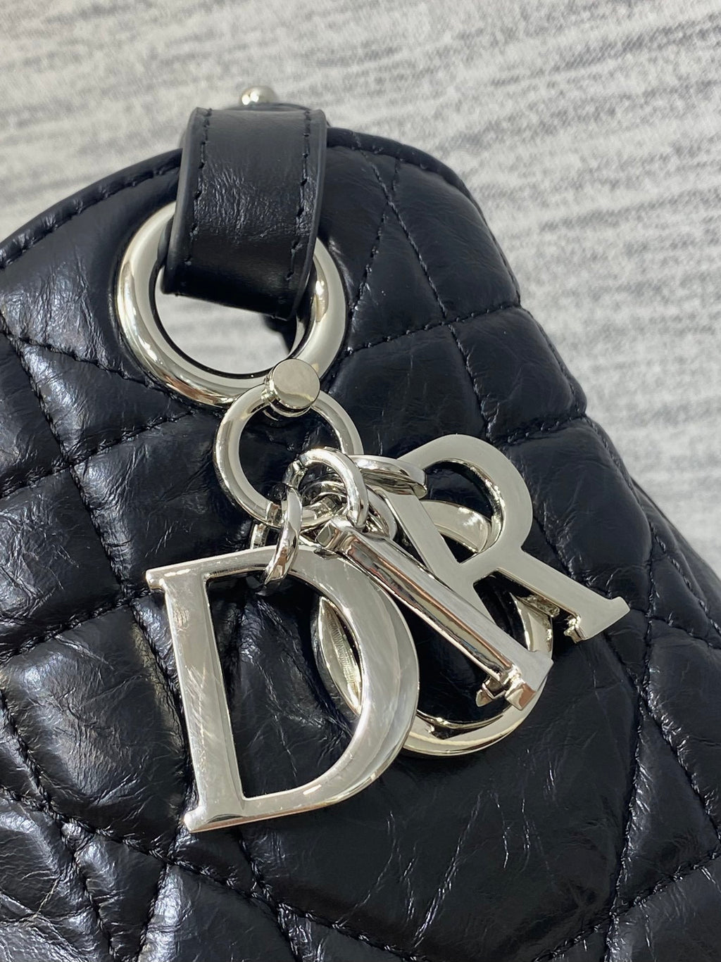 Dior Caro Motion Medium Drawstring Bucket Bag Black Aged Leather Quilted Crossbody 1026