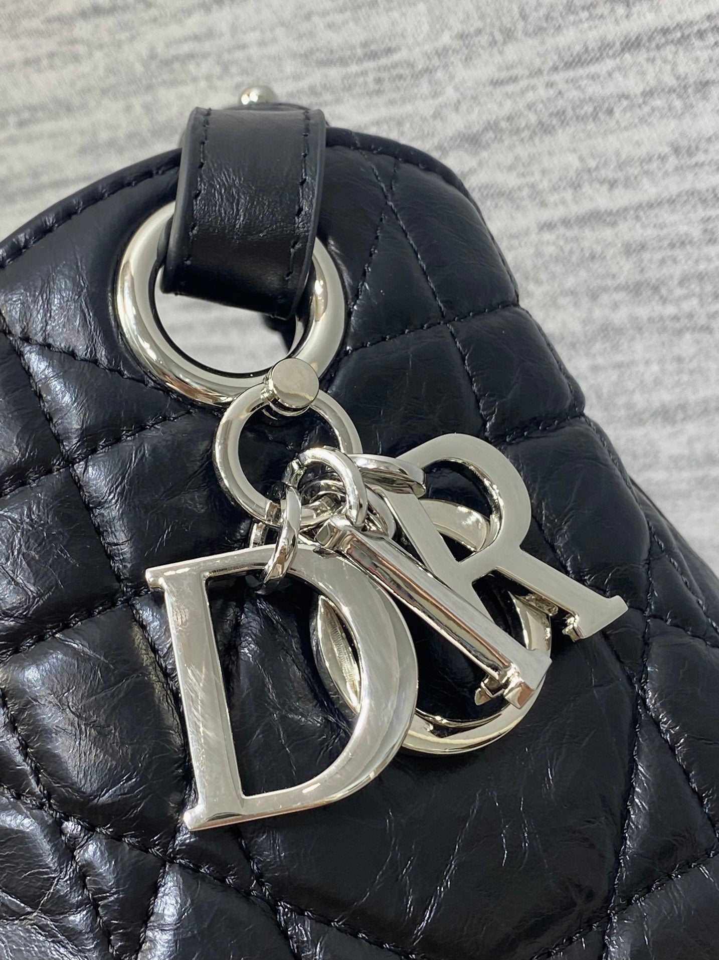 Dior Caro Motion Medium Drawstring Bucket Bag Black Aged Leather Quilted Crossbody 1026