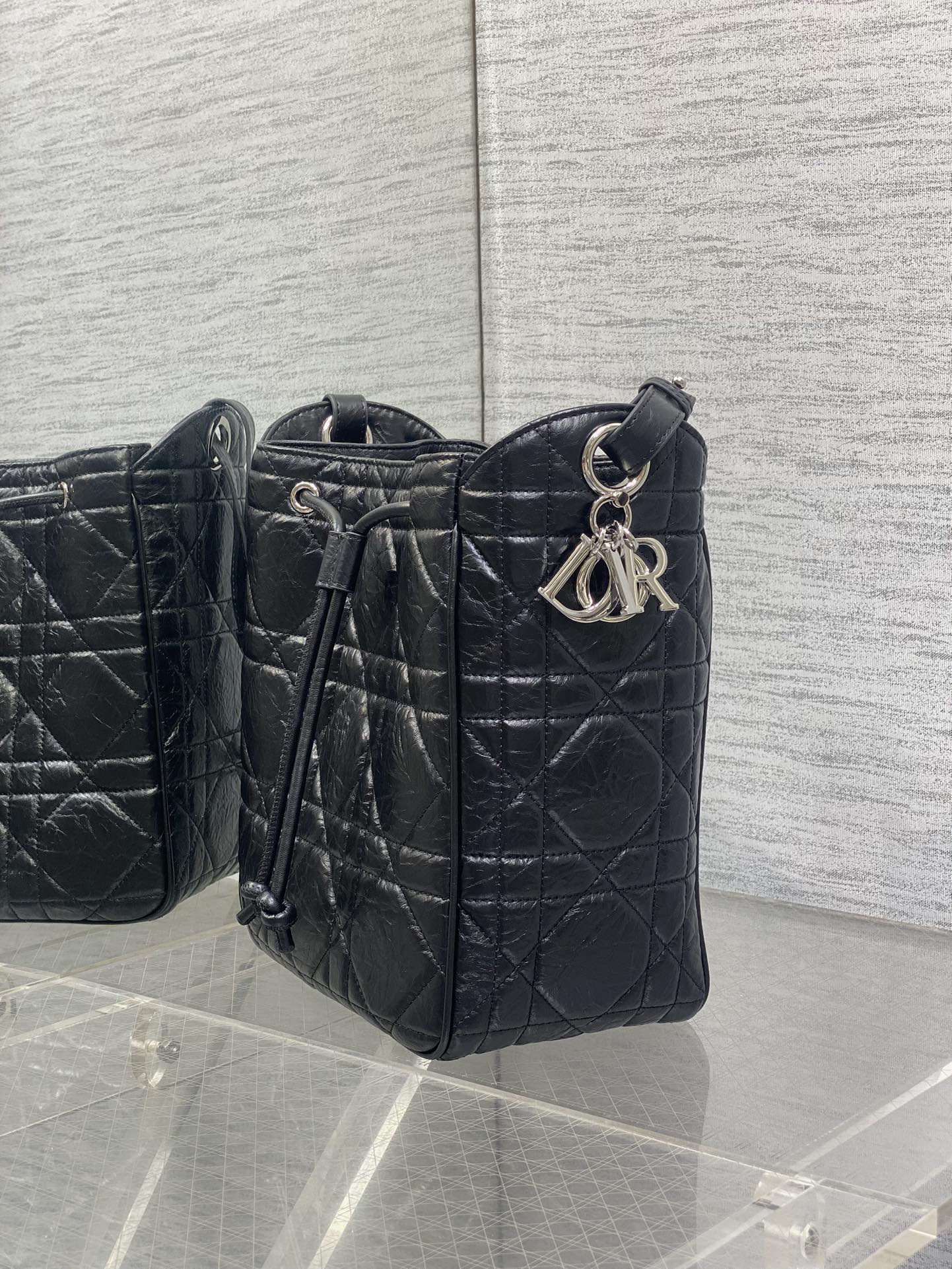 Dior Caro Motion Medium Drawstring Bucket Bag Black Aged Leather Quilted Crossbody 1026