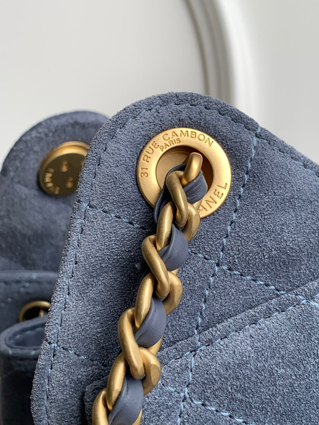 Chanel Mini Drawstring Bucket Bag with Gold CC Medallion (26C) — Denim Blue Suede