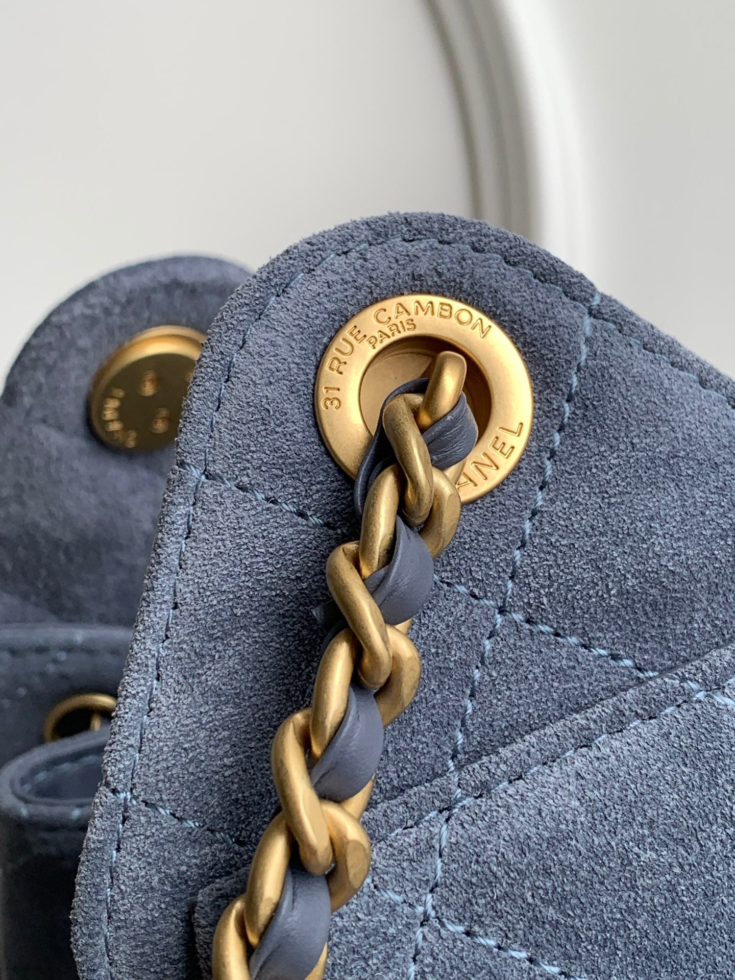 Chanel Mini Drawstring Bucket Bag with Gold CC Medallion (26C) — Denim Blue Suede