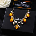 Chanel Mediterranean Matte Gold Lemon Pearl Charm Statement Necklace