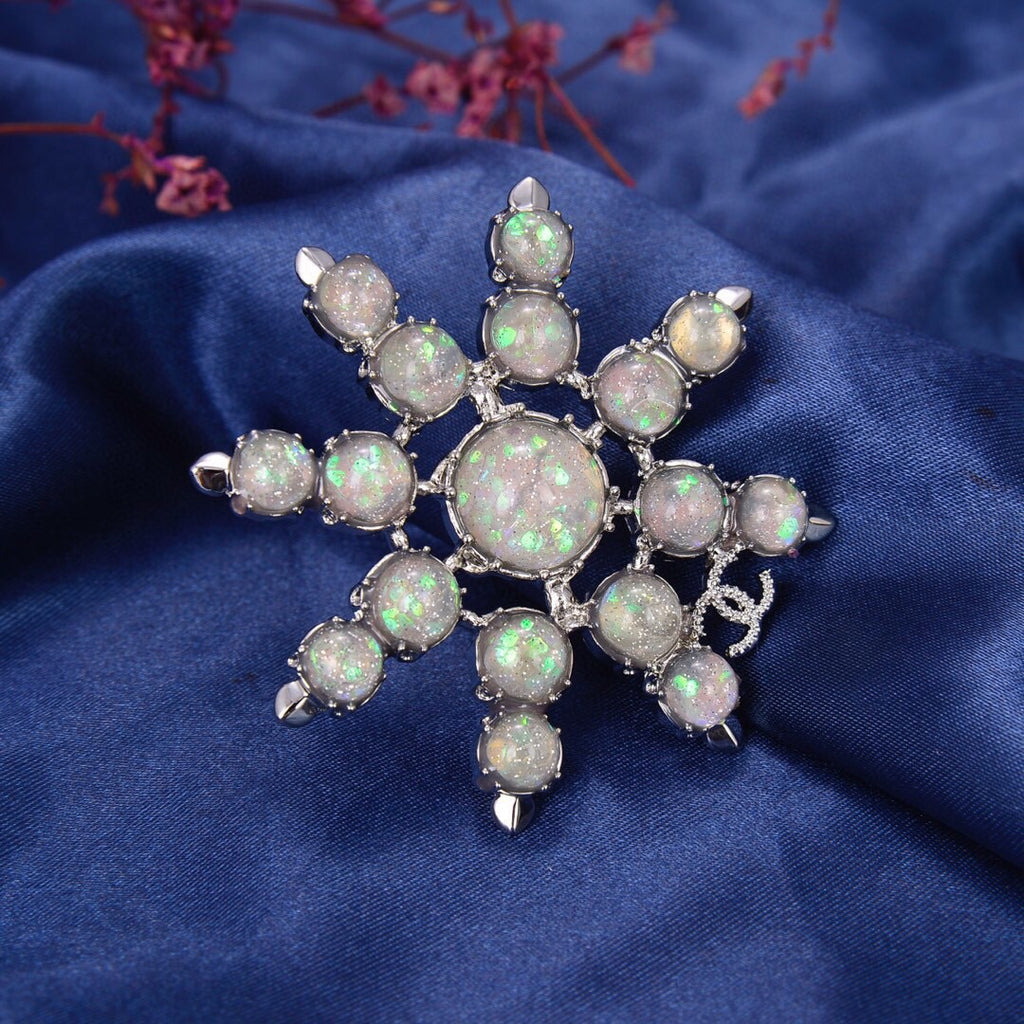 Chanel Winter Wonderland Silver Snowflake Opal-Effect Starburst CC Brooch