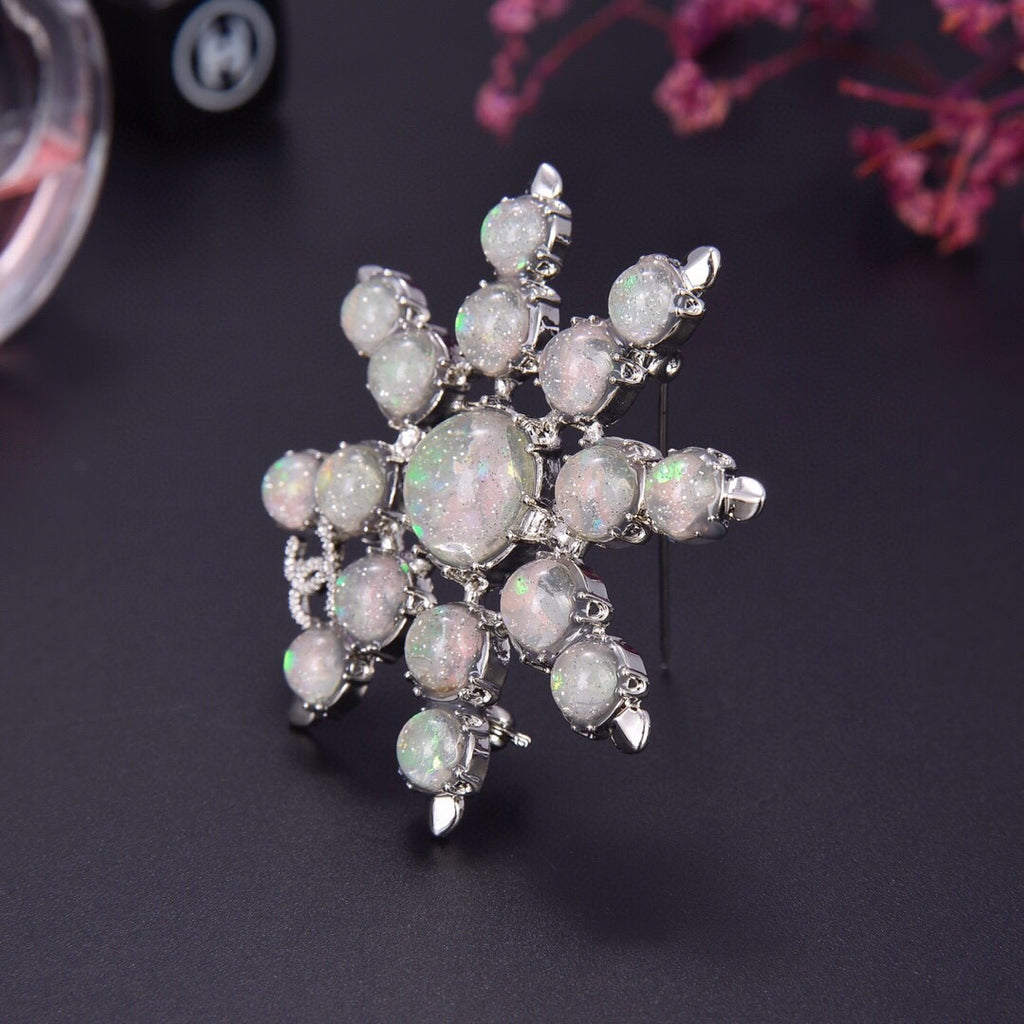 Chanel Winter Wonderland Silver Snowflake Opal-Effect Starburst CC Brooch