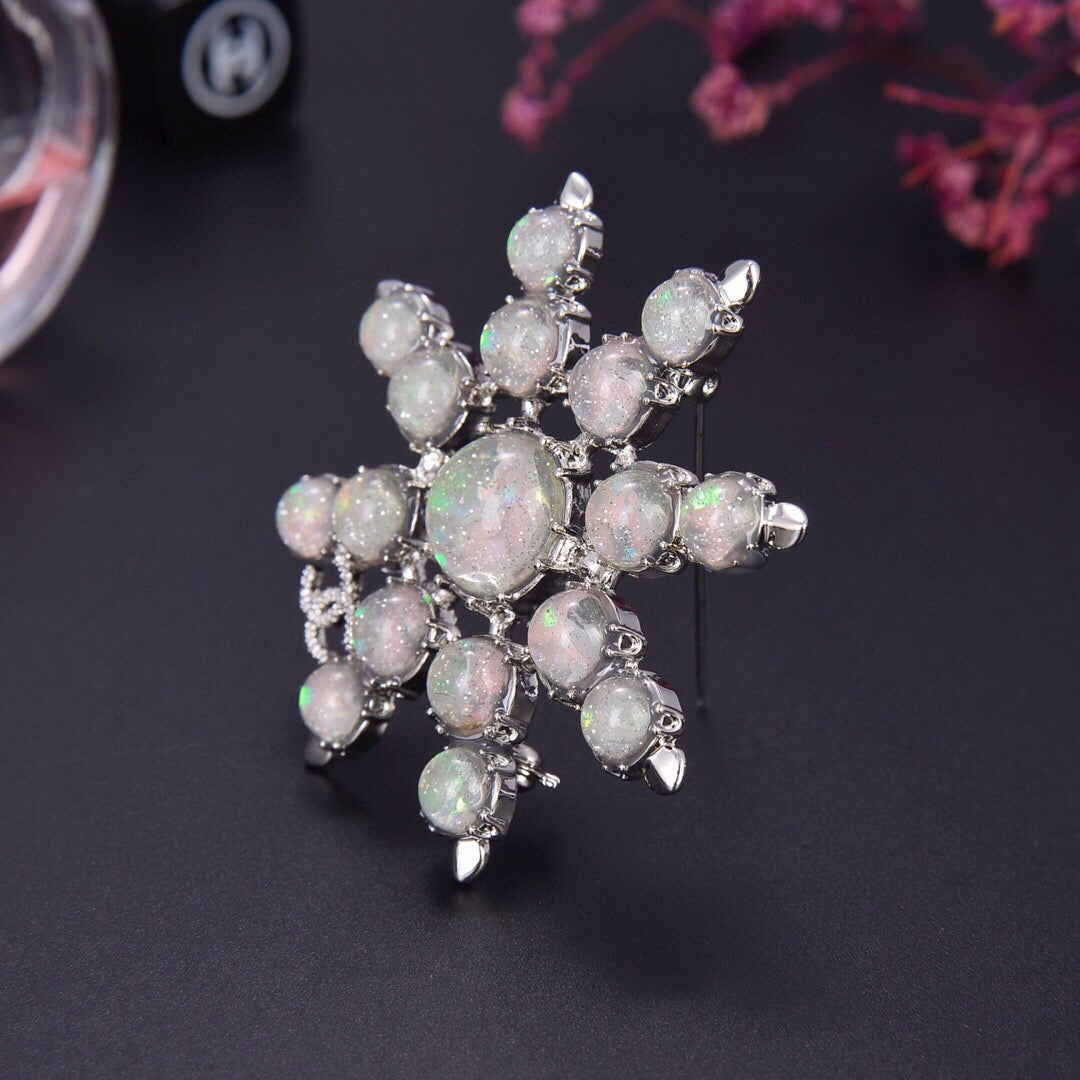 Chanel Winter Wonderland Silver Snowflake Opal-Effect Starburst CC Brooch