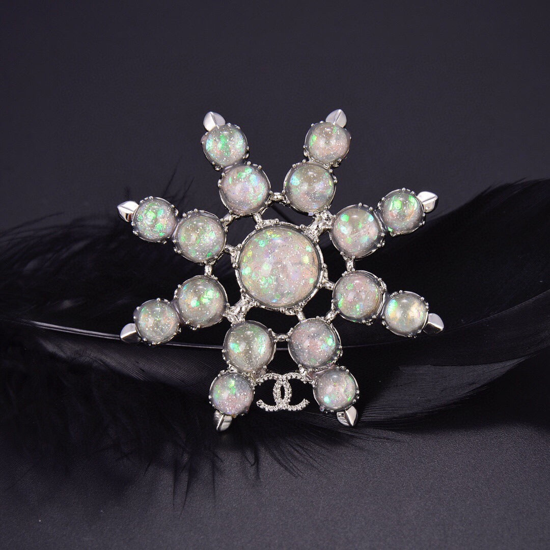 Chanel Winter Wonderland Silver Snowflake Opal-Effect Starburst CC Brooch