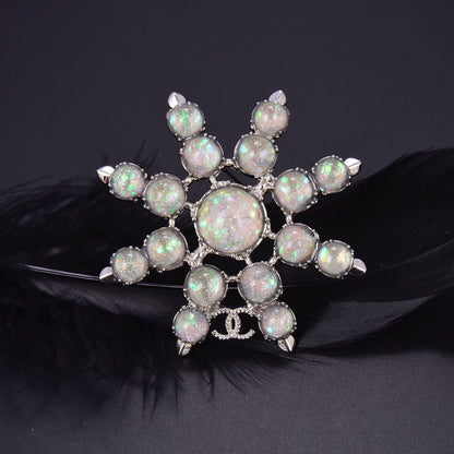 Chanel Winter Wonderland Silver Snowflake Opal-Effect Starburst CC Brooch