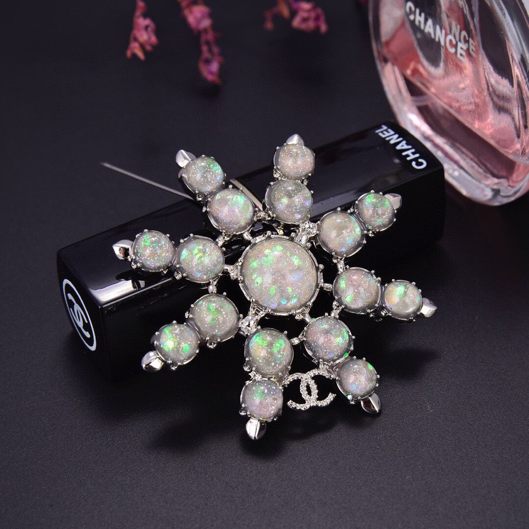 Chanel Winter Wonderland Silver Snowflake Opal-Effect Starburst CC Brooch