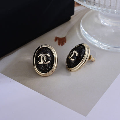 CHANEL Style Gold-Tone Vintage Oval Glitter Black Enamel CC Logo Stud Earrings