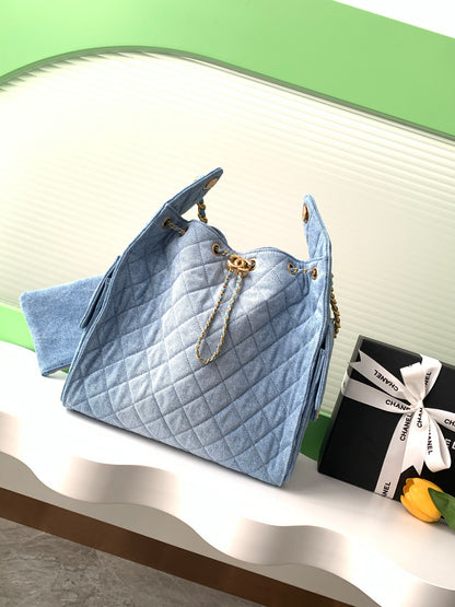 Chanel 25P Quilted Denim Drawstring Bucket Bag — Light Blue